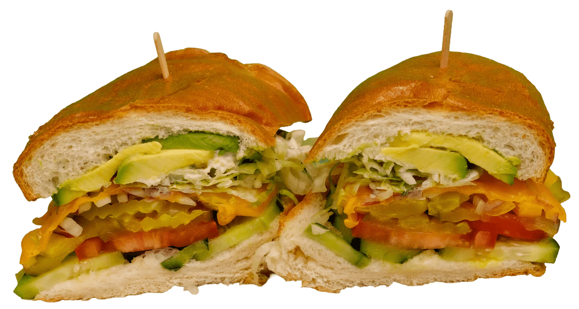 Two wraps, cut in half, reveal a filling of chicken, creamy white sauce, red cabbage, shredded carrots, fresh green herbs, and a sprinkle of red spice.