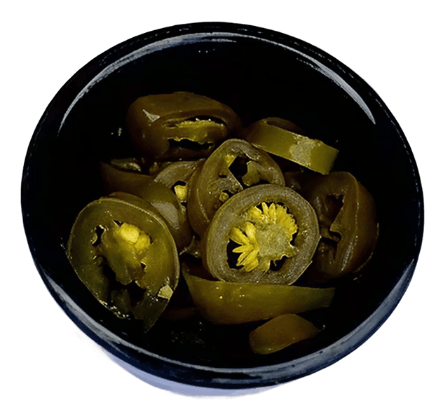 A black bowl filled with many green sliced pickled jalapeño peppers, viewed from above.