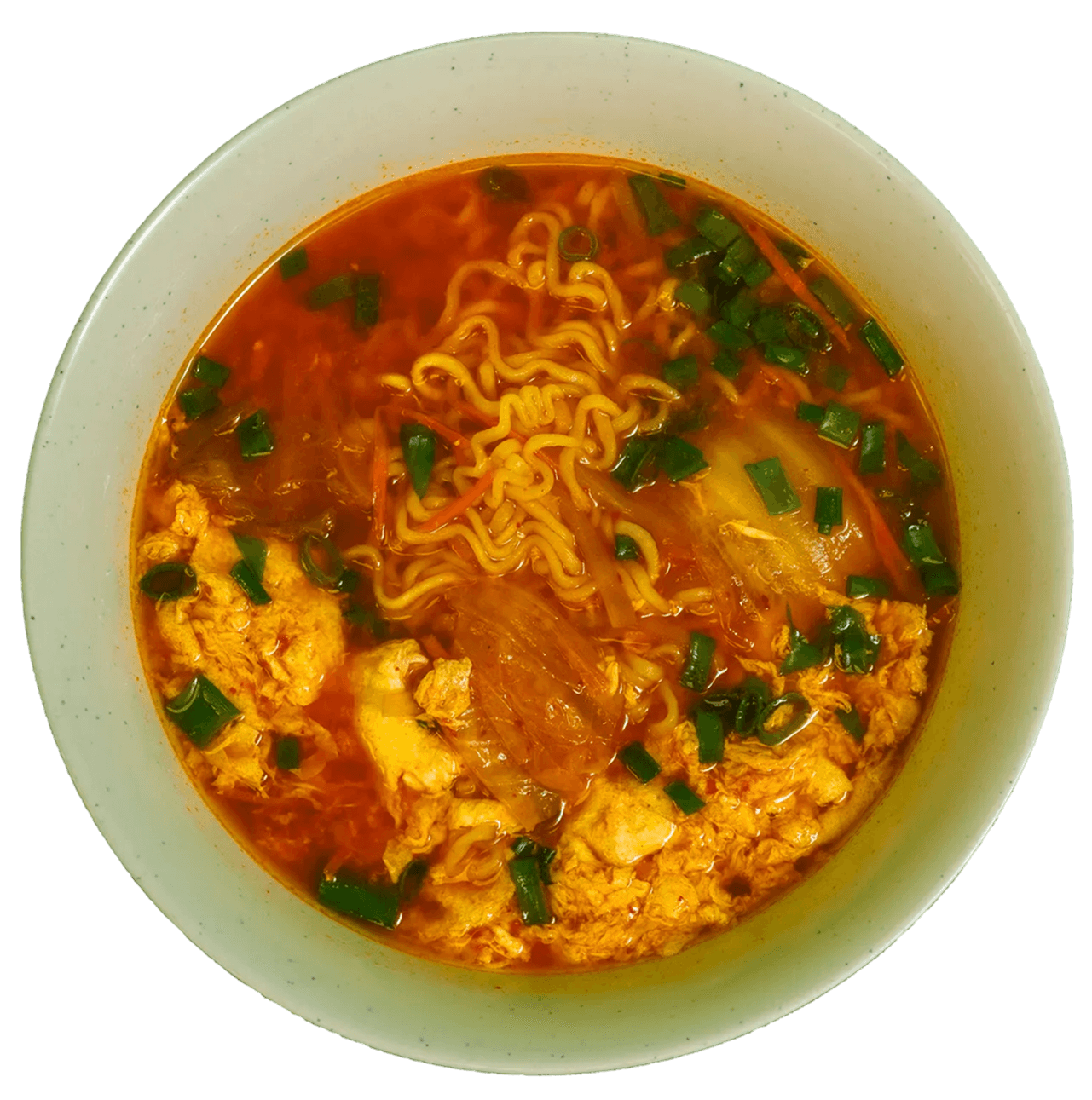 A top-down view of a bowl of spicy ramen with wavy noodles, kimchi, scrambled egg, and green onions in a rich red broth.