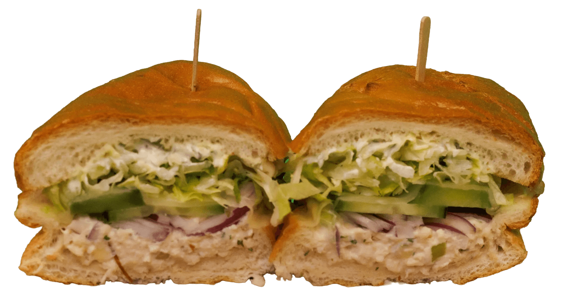 A sandwich cut in half, revealing almond chicken salad, shredded lettuce, cucumber, and red onion on a crusty roll, held together with two toothpicks.