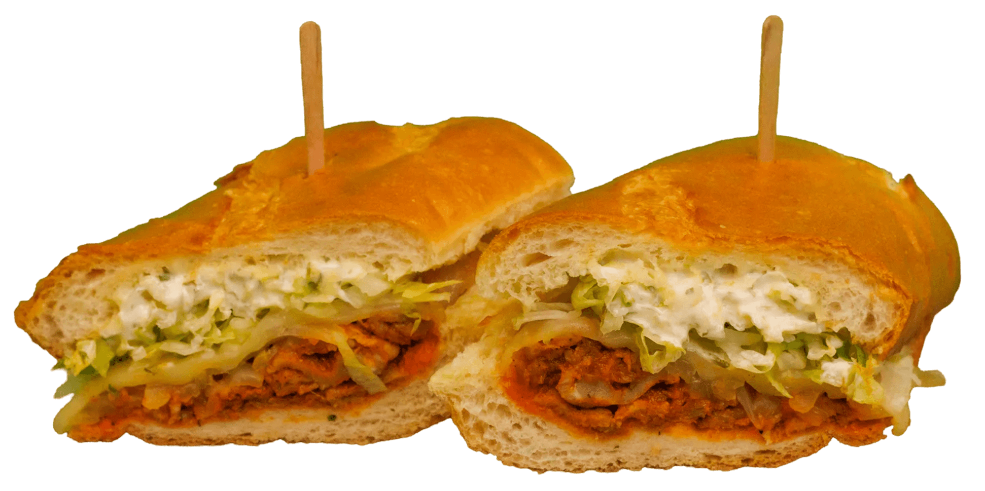 Two halves of a golden-crusted sandwich, filled with shredded lettuce, creamy white sauce, and a reddish-orange seasoned meat filling.