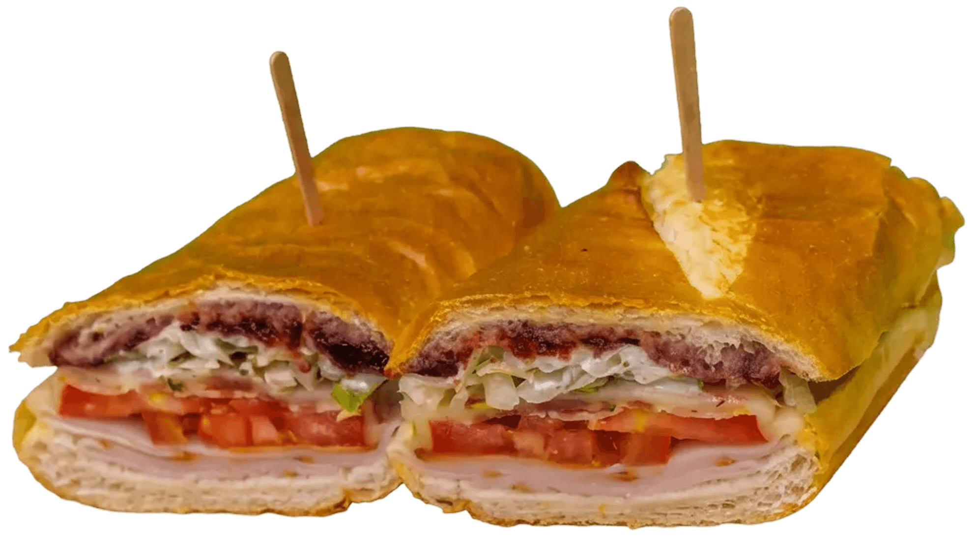 A large sub sandwich, cut in half, showing layers of turkey, cheese, shredded lettuce, tomato, and a dark cranberry spread on golden-brown bread, held by two wooden toothpicks.